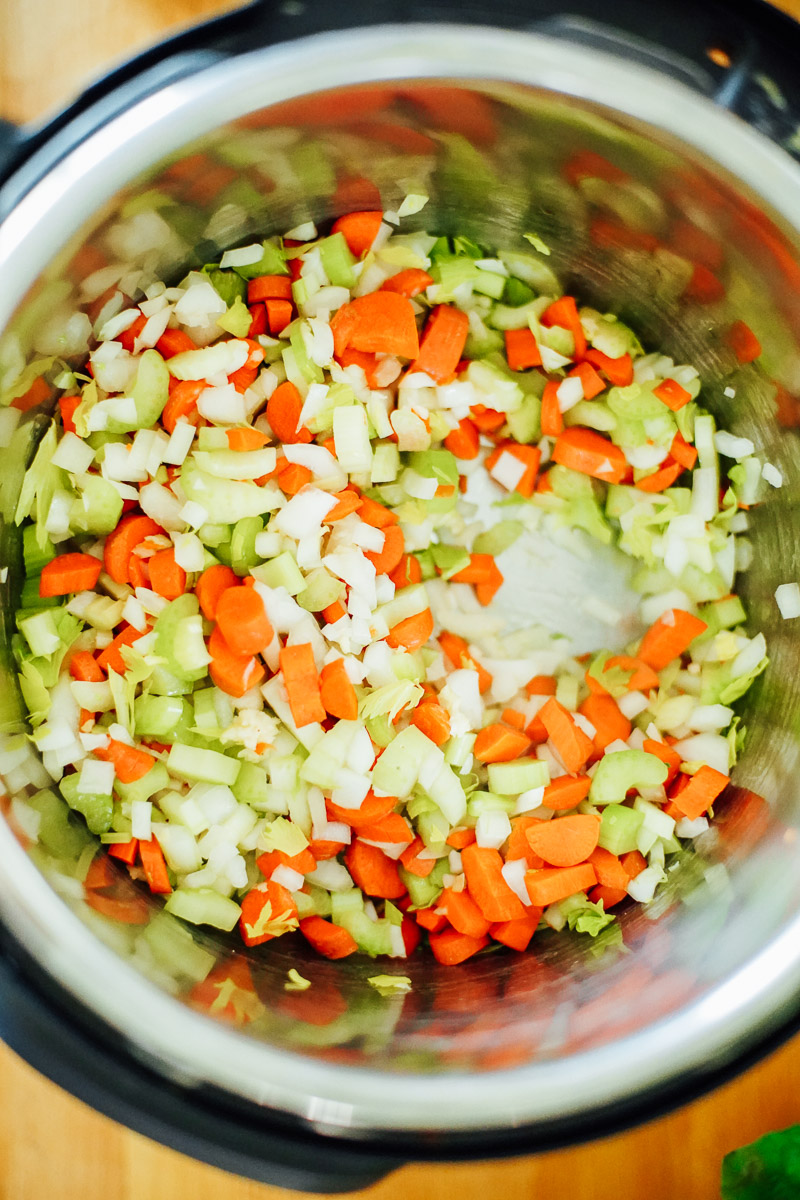 Chopped veggies in the hot Instant Pot.