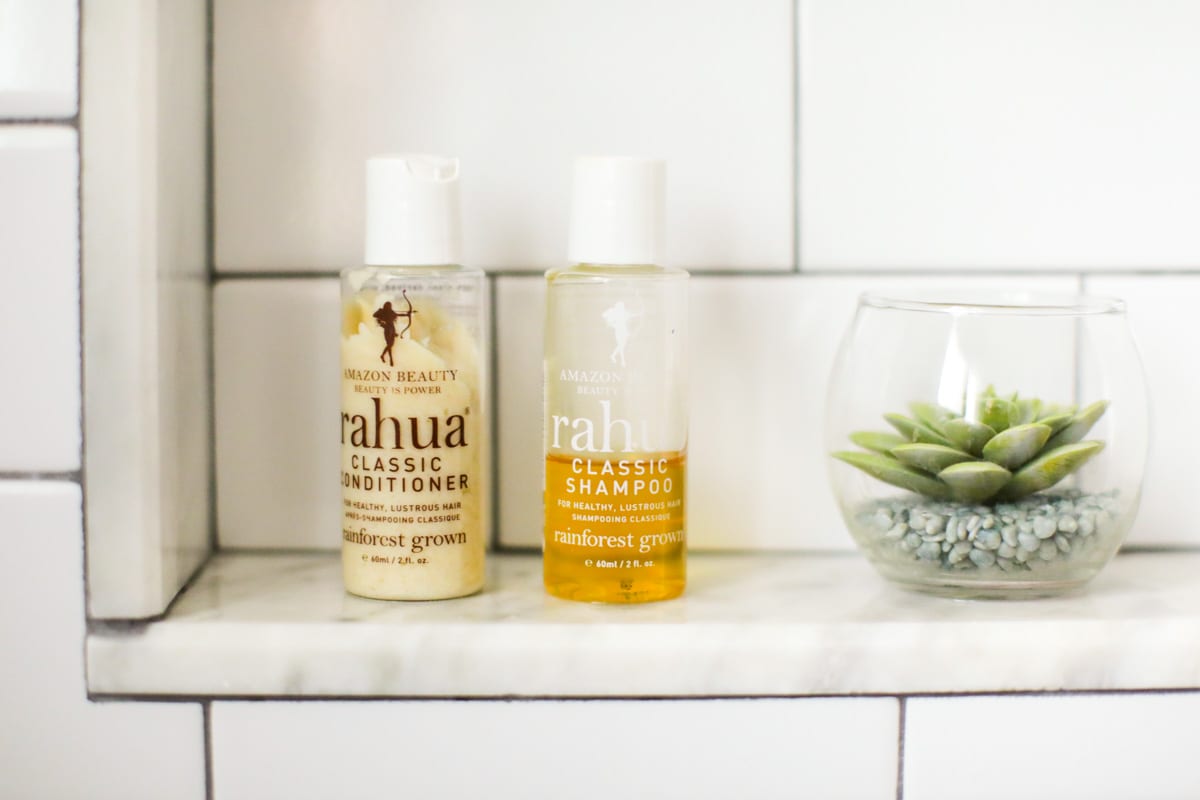 Rahua shampoo and conditioner in the bathroom.